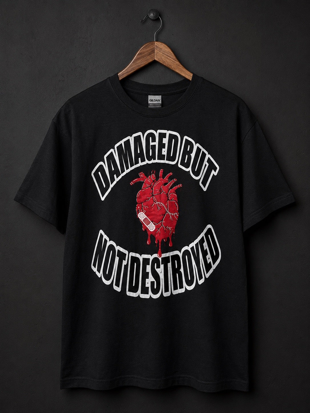 Damaged But Not Destroyed — 2 Corinthians 4:8–9 | Tee